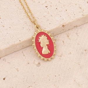 Detail of a red enamel oval pendant with gold silhouette on a link chain necklace