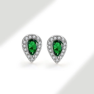 Macro detail of teardrop green zircon halo stud earrings in 925 sterling silver