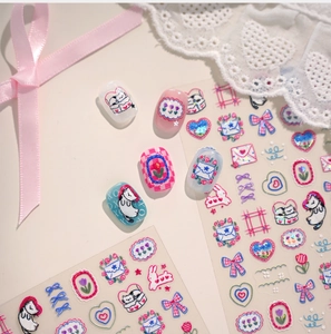 Detail of 3D embossed nail stickers with cute cat and tulip patterns for DIY manicure
