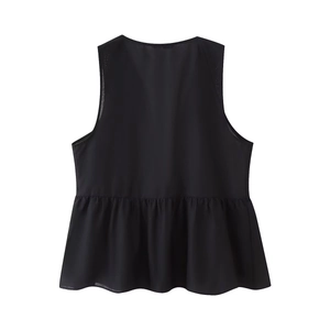 Detail of black sleeveless blouse featuring a round neck and peplum hem with embroidery