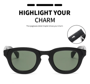 Close-up of retro round black sunglasses with silver diamond rivets and dark lenses
