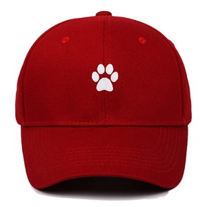 Red cotton baseball cap featuring white embroidered cartoon cat paw on the front