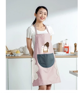 Pink waterproof apron with grey pocket and side absorbent towels shown in kitchen setting