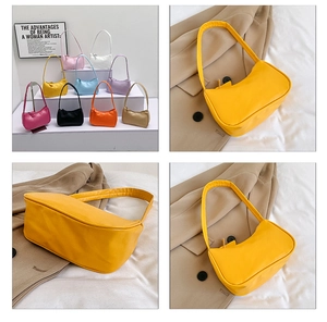 Detailed close-up of vibrant leather shoulder bags showing sleek texture and nine color options