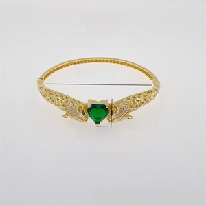 Detail view of 18K gold plated leopard head bangle with heart green zircon stone and dimensions
