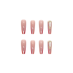 Long ballerina press-on nails with red V-shape French tips and 3D rhinestone crystal accents
