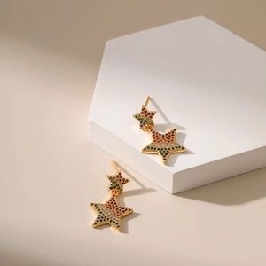Bohemian gold star earrings with colorful gradient cubic zirconia in a double star design