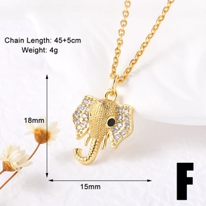 Detailed view of gold elephant pendant with white crystals and 45+5cm chain size info