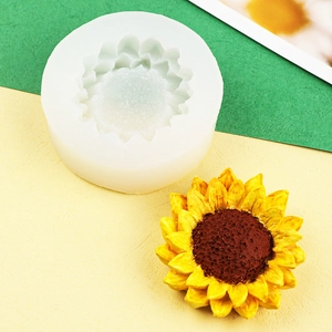 Macro detail of sunflower silicone mold with yellow finished resin flower on dual-tone background