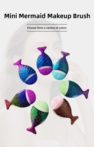 Detail view of mini mermaid makeup brushes with fish scale texture and gradient handles