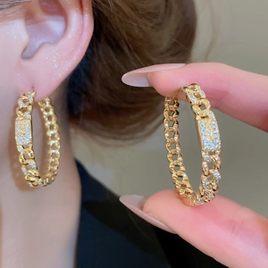 Detail of 18k gold plated Cuban link earrings with pavé cubic zirconia accents