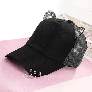 Detail of black cat-ear baseball cap with rhinestone accents and metal ring brim