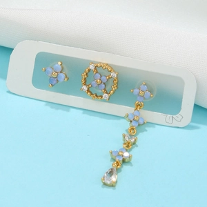 Three-piece light blue orchid earring set with gold plating and synthetic opal stones