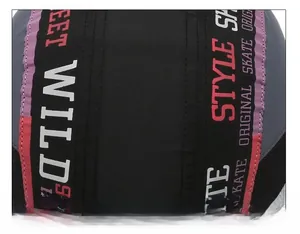 Close-up of black baseball cap seams with red and purple street style printed ribbons