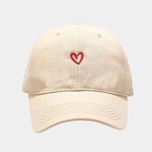 Minimalist beige baseball cap with red heart embroidery on high quality cotton canvas
