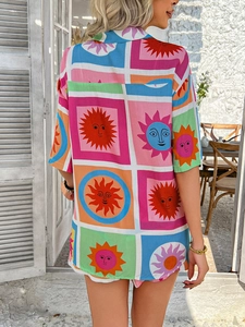 Detailed back view of a colorful geometric print short sleeve shirt with sun face patterns