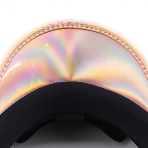 Close-up of holographic leather peak with double-stitching on champagne gold party hat