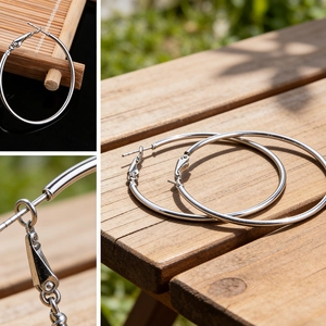 Detailed close-up of large minimalist silver hoop earrings and secure clasp mechanism