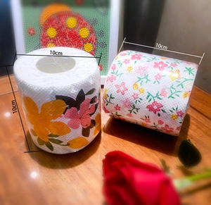 Close-up of printed toilet paper rolls with large and small floral patterns 10cm