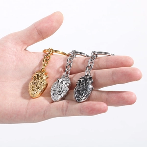 Human heart shaped metal keychains in gold, silver and gunmetal finish for gift