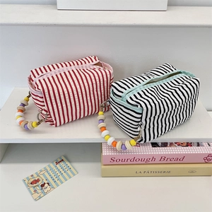 Striped cotton fabric tissue pouch and organizer bag with colorful wooden bead handle
