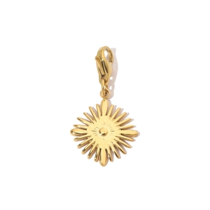 Detail of a gold-plated sunburst pendant with sparkling center stone and lobster clasp