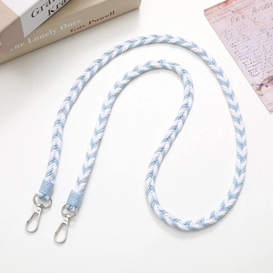 Detail shot of a blue and white woven phone strap with silver lobster metal clasps