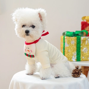 Close-up of cream knit pet sweater with snowman pattern Christmas bib for small dogs