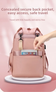 Pink waterproof nylon diaper backpack with anti-theft back pocket and USB charging port