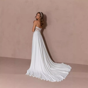 Elegant white lace bodice wedding dress with satin train and floral embroidery