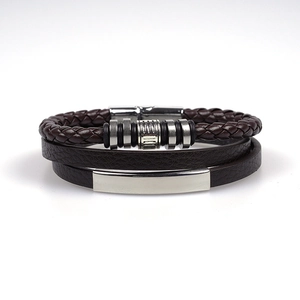 Detail of multi-layer brown braided leather bracelet with silver alloy magnetic clasp