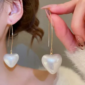 Fashionable heart pearl dangle earrings with gold hooks for women stylish unique design