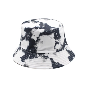 Reversible tie-dye bucket hat in black and white marble pattern with reinforced brim