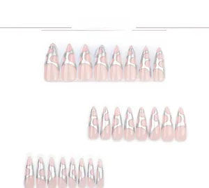 Detail of stiletto press-on nails with pink base and irregular silver chrome stripes