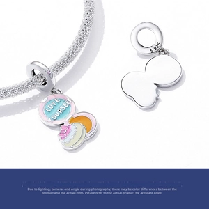 Macro view of S925 silver Love Yourself charm with pink enamel for DIY bracelets