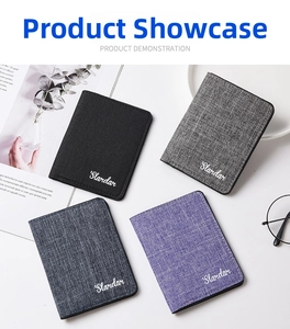 Flat lay of slim canvas card wallets in black, grey, blue, and purple textured fabric