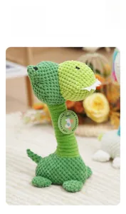 Detailed view of plush dinosaur squeaky toy with knitted corn velvet texture and green tags