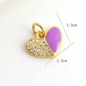 Detail of a 1.3cm x 1.2cm purple enamel and sparkling rhinestone heart pendant
