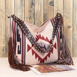 Close-up of woven canvas texture and colorful geometric patterns on the bohemian tote bag