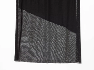 Close-up of black sheer mesh fabric detailing the delicate textured net structure