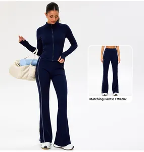 Close-up of dark blue yoga jacket with thumb holes and matching flare sports pants
