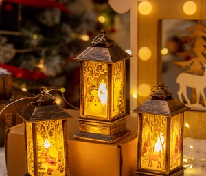 Detail of three bronze Christmas lanterns with Santa, Snowman and Reindeer patterns