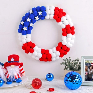 Patriotic July 4th red white and blue pompom wreath with white stars and plush gnomes