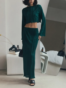 Elegant dark green pleated two-piece set with long sleeve crop top and long skirt
