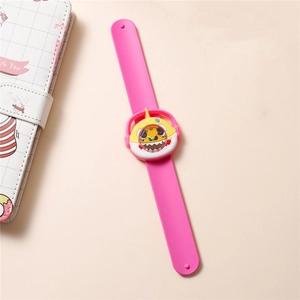 Close-up of kids quartz watch with pink silicone snap band and shark-shaped yellow dial