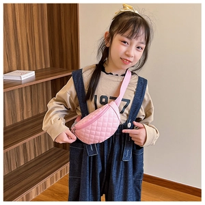 Detail of pink quilted PU leather chest bag for kids with gold zipper and stylish strap