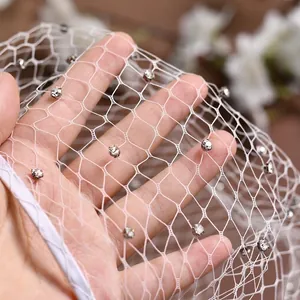 Elegant white bridal headband with hexagonal honeycomb mesh and sparkling silver rhinestones
