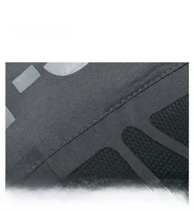 Detailed macro view of dark grey mesh fabric and double stitching on sports cap