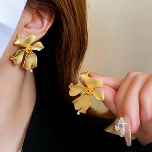 Matte gold vintage large flower stud earrings with a textured luxury metallic finish