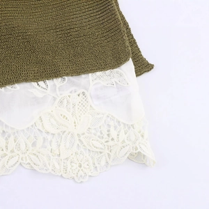 Chic olive green knit sweater featuring white lace patchwork hem and floral embroidery